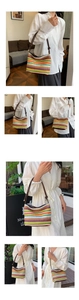 Detail of colorful rainbow stripe woven straw bucket bag with dark brown leather shoulder strap