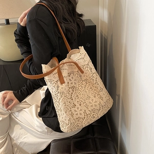 Chic hollow out crochet lace tote bag with brown leather straps for summer casual style