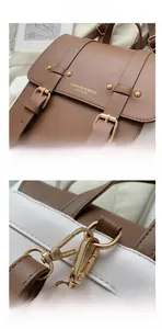 Detail view of contrast PU leather backpack with gold buckles and litchi texture