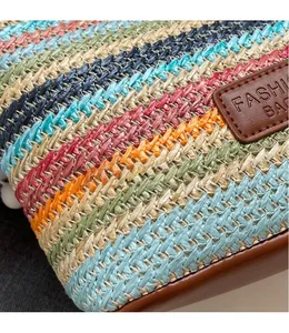 Macro shot of colorful woven fiber texture and brown leather base on a bucket bag