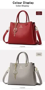 Detail of red and grey textured tote bags featuring heart lock charms and adjustable straps