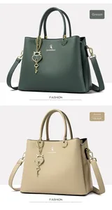 Close-up of green and khaki tote bags with heart charm and pebbled faux leather texture