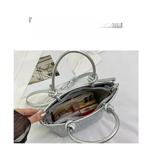 Silver glitter handbag showing spacious interior for phone, makeup, and essentials