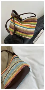 Close-up of rainbow striped woven bag with brown leather handles and gold metal accents