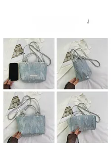 Multi-angle views of denim handbag with silver sequins and metallic top handle