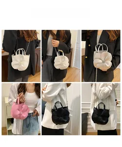 Chic 3D camellia flower bucket bag shown in multiple colors with elegant chain straps