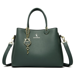 Dark green lychee pattern leather tote bag with dual handles and heart pendant decoration
