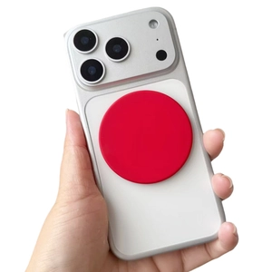 Magnetic smartphone back cover with silver frame and red circular ring detail in hand