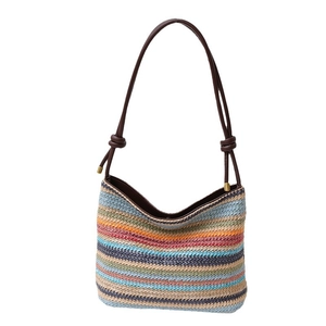 Rainbow striped woven straw shoulder bag with dark brown leather straps and gold accents