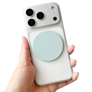 Close-up of white matte phone case with light green magnetic ring and camera lens protection