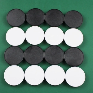 Macro view of 16 black and white circular DIY phone socket bases in a grid layout