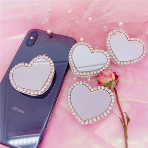 Détails de supports de téléphone cœur avec miroir et strass sur tissu en dentelle rose