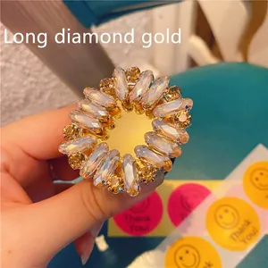 Detailed macro view of the sparkling rhinestone phone stand in flower shape gold finish
