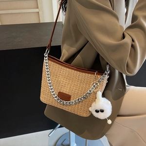 Fashion straw woven crossbody bucket bag with chain strap and plush pendant accessory