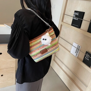 Colorful striped straw bucket bag with silver chain strap and plush ball charm