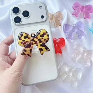 Leopard print bow phone grip stand with assorted colors on polished acrylic material