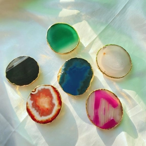Detailed view of natural agate stones with gold electroplated edges in six colors