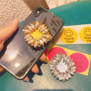 Crystal flower phone socket with sparkling rhinestones for secure grip and stand