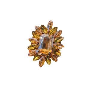 Floral crystal phone socket with rectangular amber gem and radiating yellow marquise stones