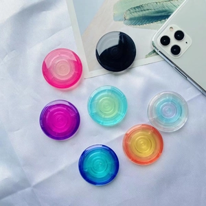 Close-up of seven colorful gradient translucent pop-up sockets for mobile phones