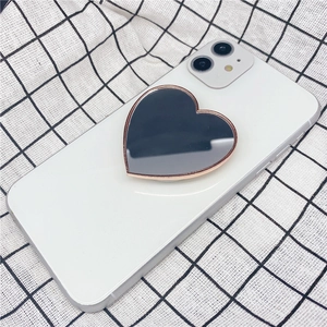 Heart-shaped mirror phone grip with black mirror finish and rose gold metal frame