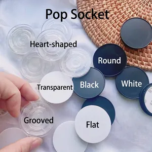 Foldable circular and heart phone grip sockets in black white and clear with 3M adhesive