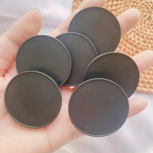 Close-up of black round folding phone socket stands for DIY custom printing and resin craft