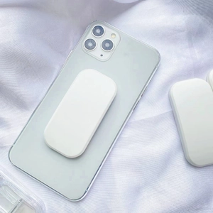 Detail view of a minimalist white matte phone stand attached to a green smartphone back