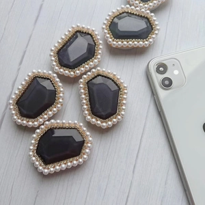 Chic pearl and gemstone expandable phone socket stand with sparkling diamond accents