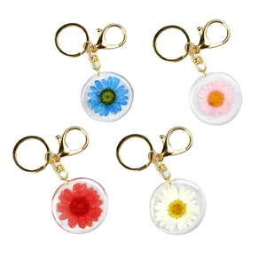 Handmade resin keychain with real dried flowers and gold metal hardware in four colors