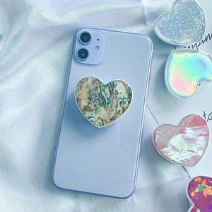 Folding heart-shaped phone socket featuring iridescent abalone shell texture on blue silk