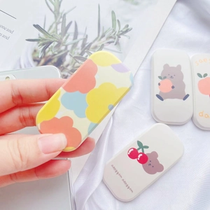 Close-up of cute cartoon cherry bear and abstract cloud telescopic phone socket grips