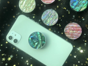 Detailed view of colorful abalone shell pattern foldable grip sockets for smartphones