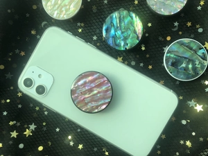 Macro detail of foldable phone sockets with colorful iridescent natural abalone shell patterns