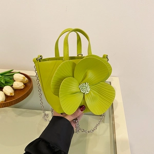 Grass green bucket bag with 3D camellia flower decor and silver chain strap