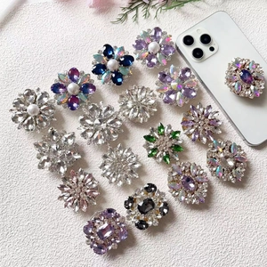 Close-up of luxury floral rhinestone phone socket grips with shimmering crystal petals