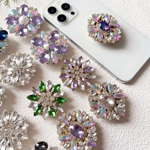 Detailed top view of luxurious flower-shaped diamond phone sockets on stone surface
