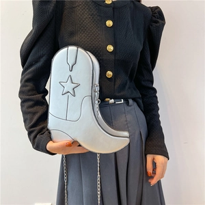 Silver metallic boot-shaped crossbody bag with star detail and metal chain strap