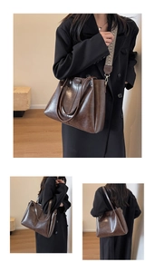 Detail der braunen Vintage-Einkaufstasche mit geometrisch gewebtem breitem Schultergurt