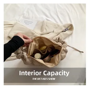 Close-up of the quilted cloud bag interior showing pockets and storage for cosmetics