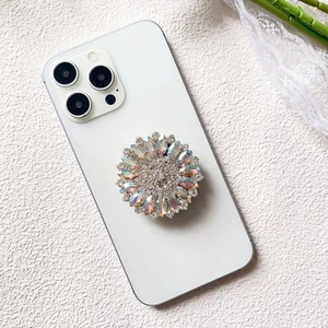 Detail of luxury rhinestone flower phone socket showing shimmering colorful crystal petals
