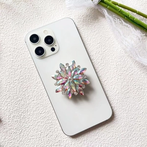 Detail of luxury flower diamond phone socket with iridescent rhinestones and metal base