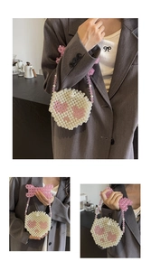 Detail of handmade pearl mini bag with pink heart pattern and decorative beaded bow