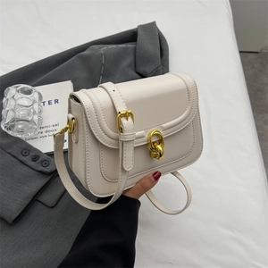 Minimalist cream shoulder bag with gold chain lock and adjustable strap for women