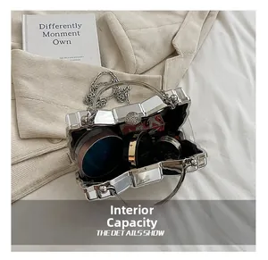 Detailed interior of the silver metallic evening bag showing makeup storage capacity
