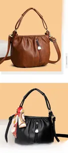 Close-up of soft pleated faux leather texture and metal zippers on chic handbags