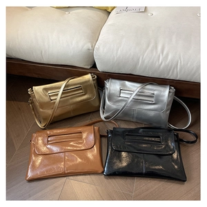 Detailed set of metallic and leather crossbody bags in gold silver brown and black
