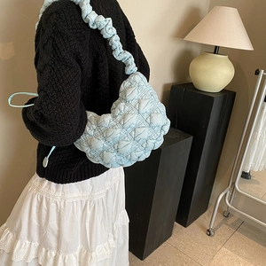 Light blue bubble quilted underarm bag with fluffy texture and ruched shoulder strap