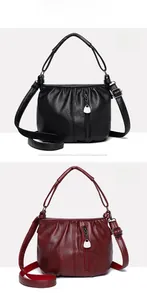 Close-up of luxury wrinkled leather texture on black and burgundy crossbody bags