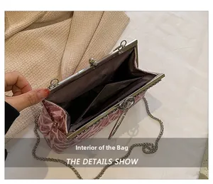 Internal view of pink floral evening bag showing inner pocket and metal clasp